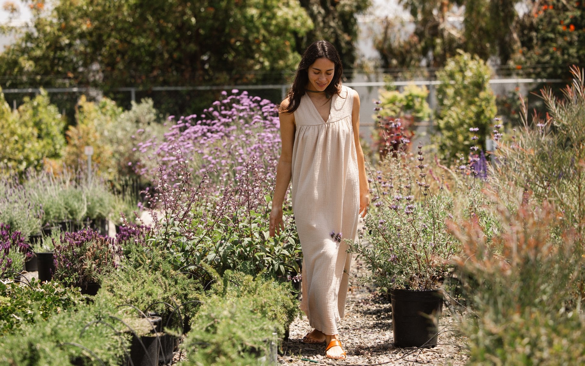 Women on the beach with muslin sundress black