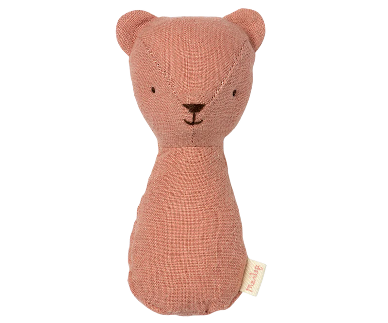 Pink teddy bear plush toy on a white background