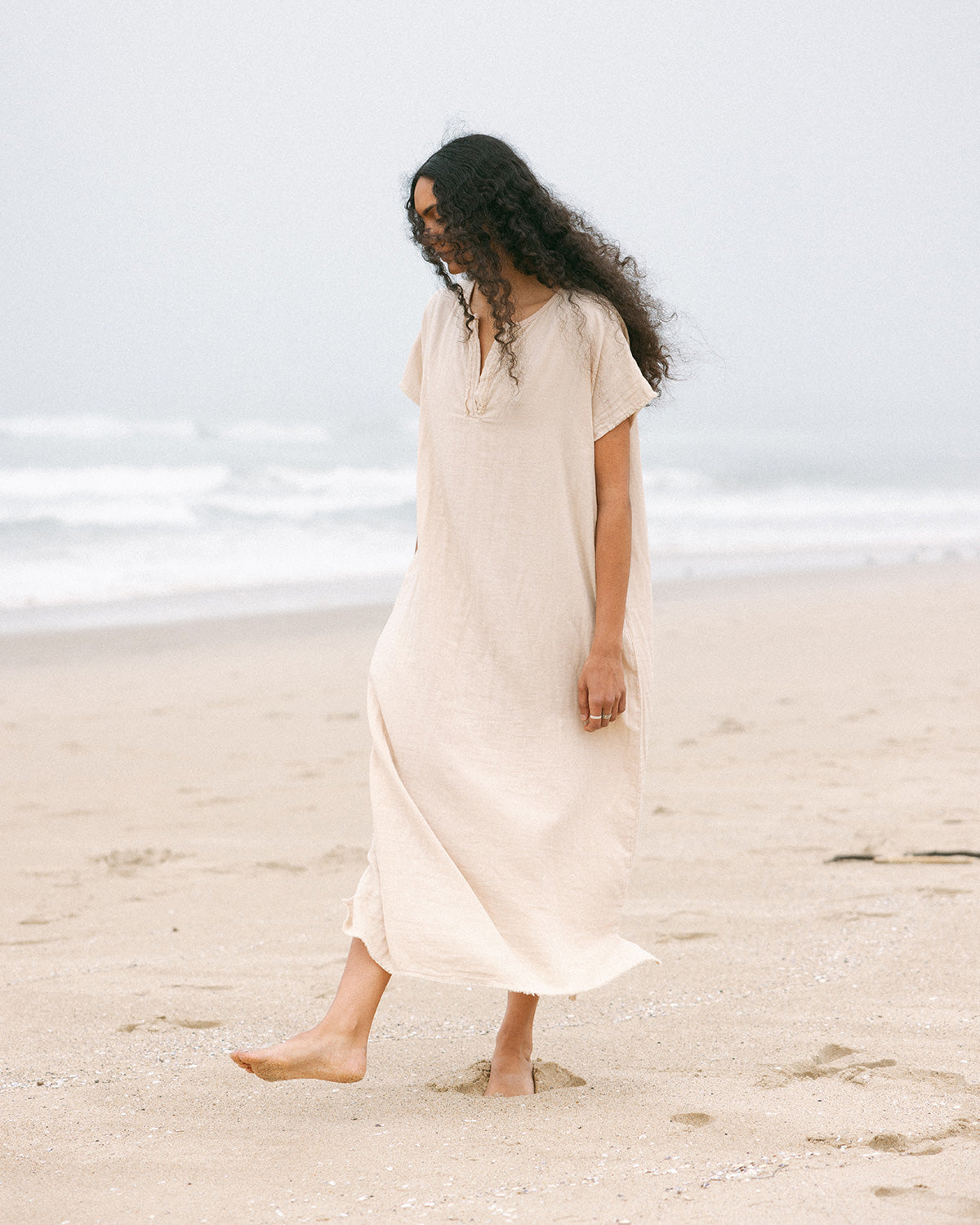 women walking on beach in caftan