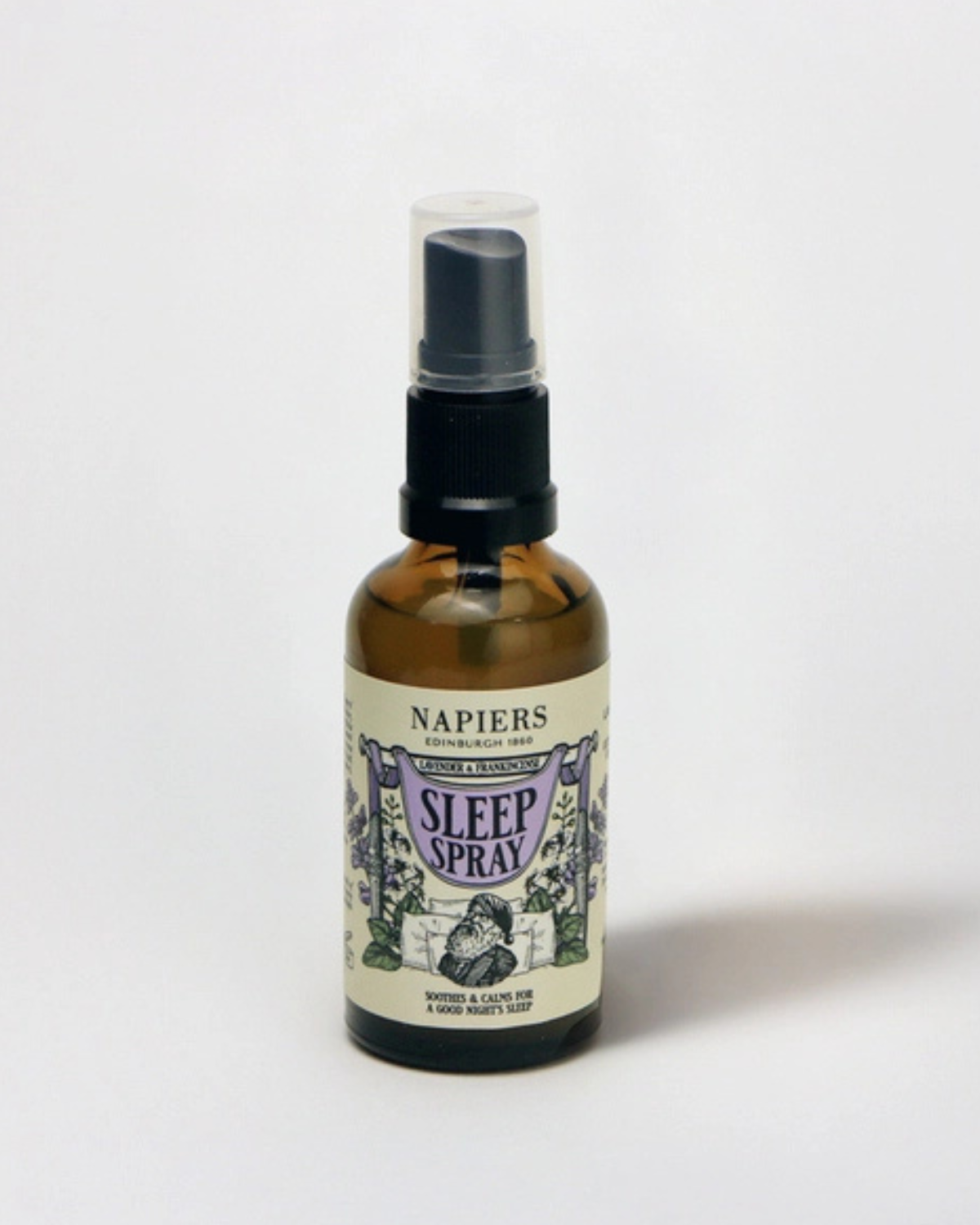 A bottle of Napiers Sleep Spray with a label featuring botanical illustrations.