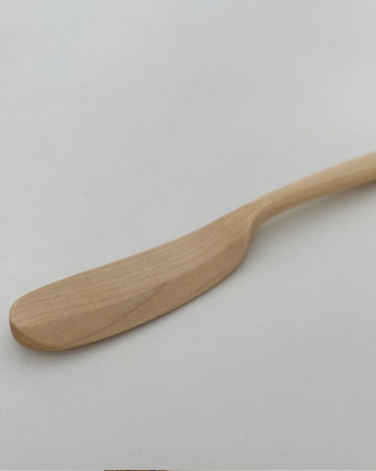 Handcrafted maple wood spreader