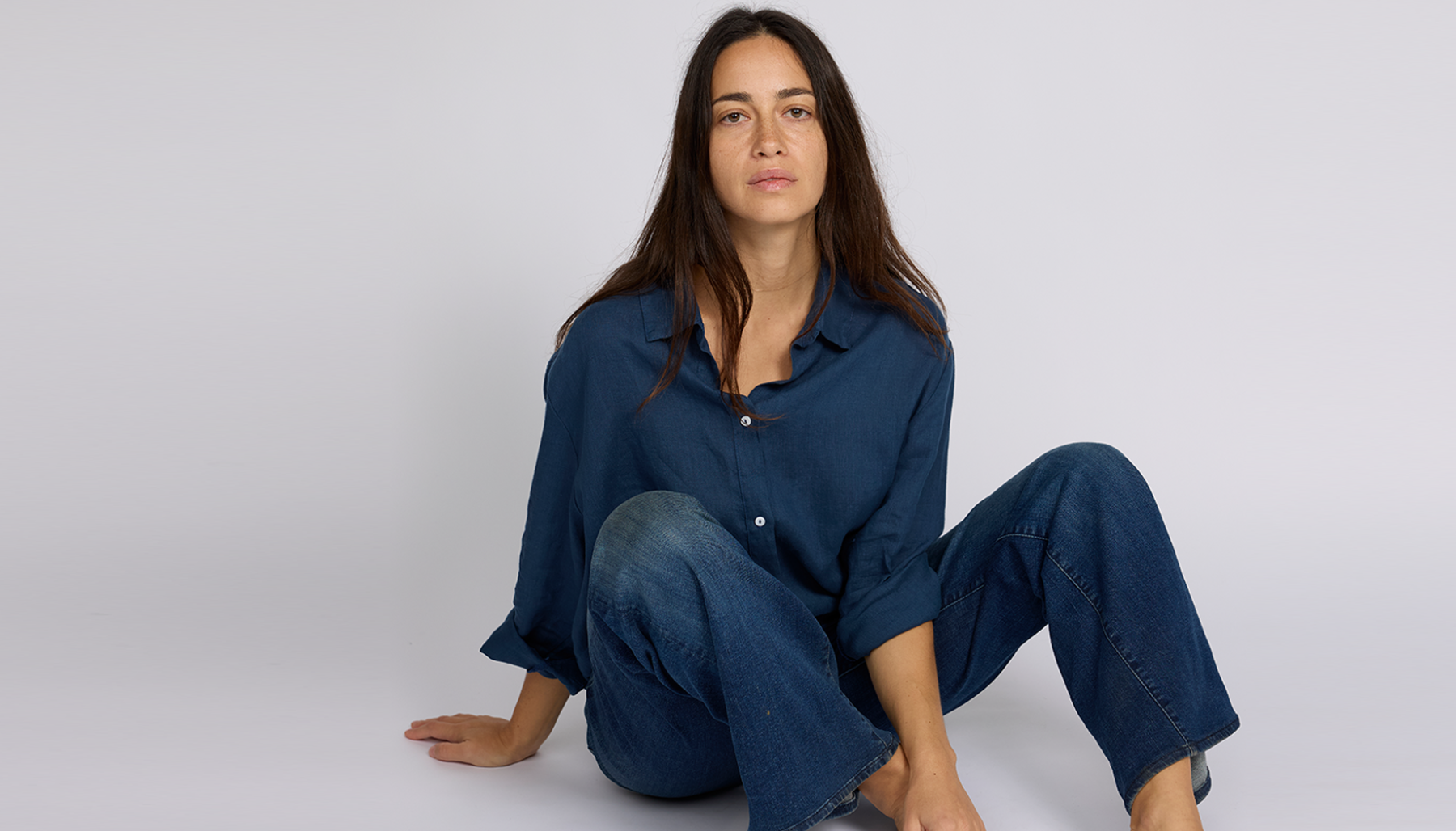 Women wear organic button down top