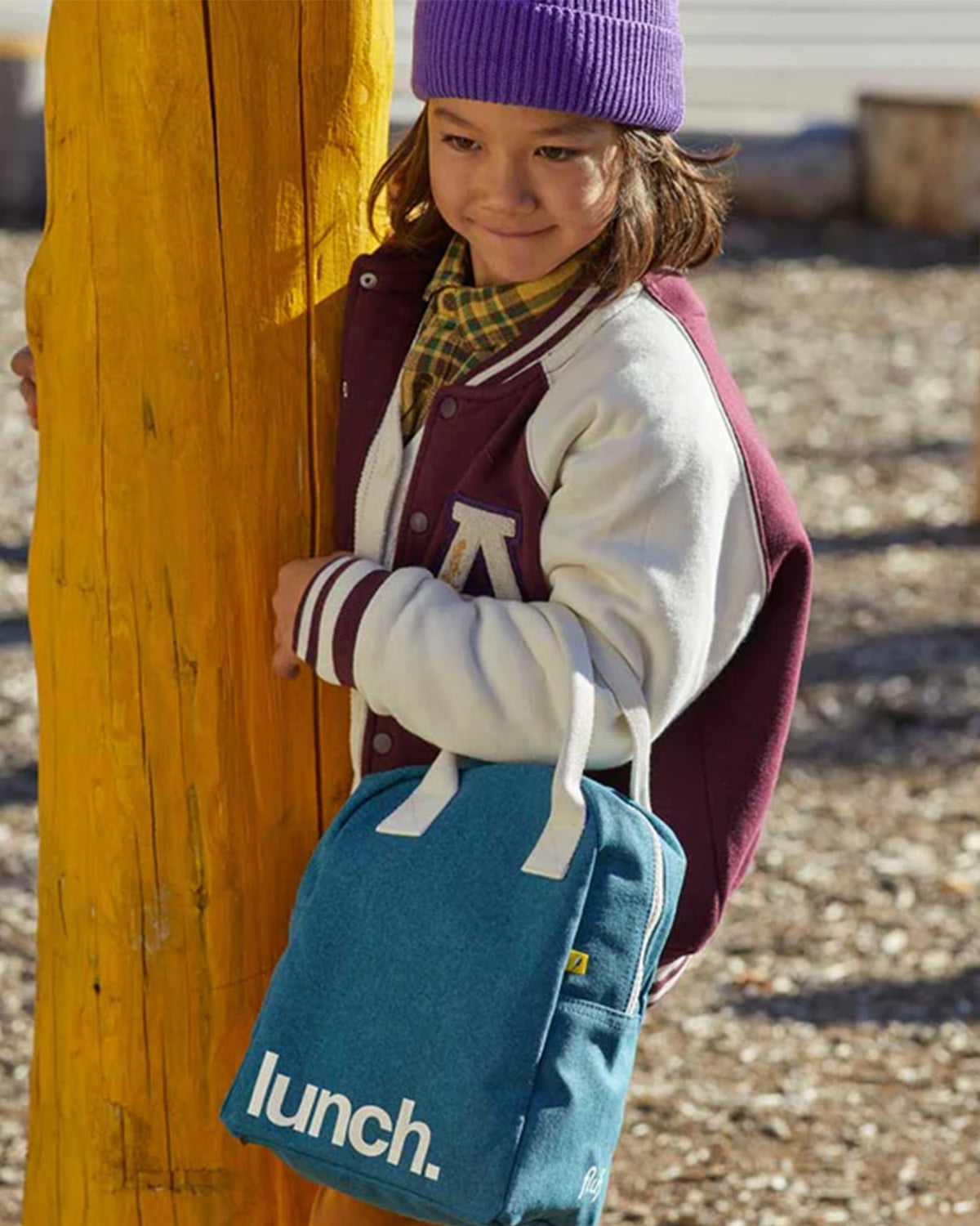 little girl with lunch bag