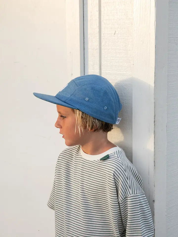 boy wearing denim cap
