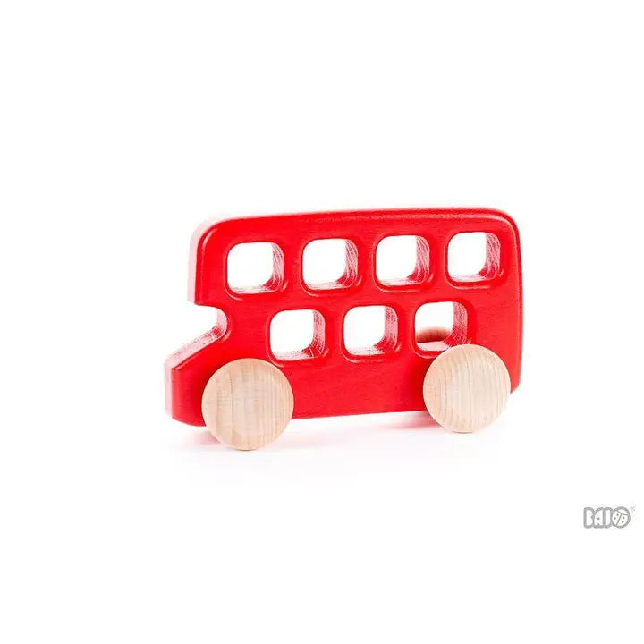 Red toy bus with wooden wheels on a white background