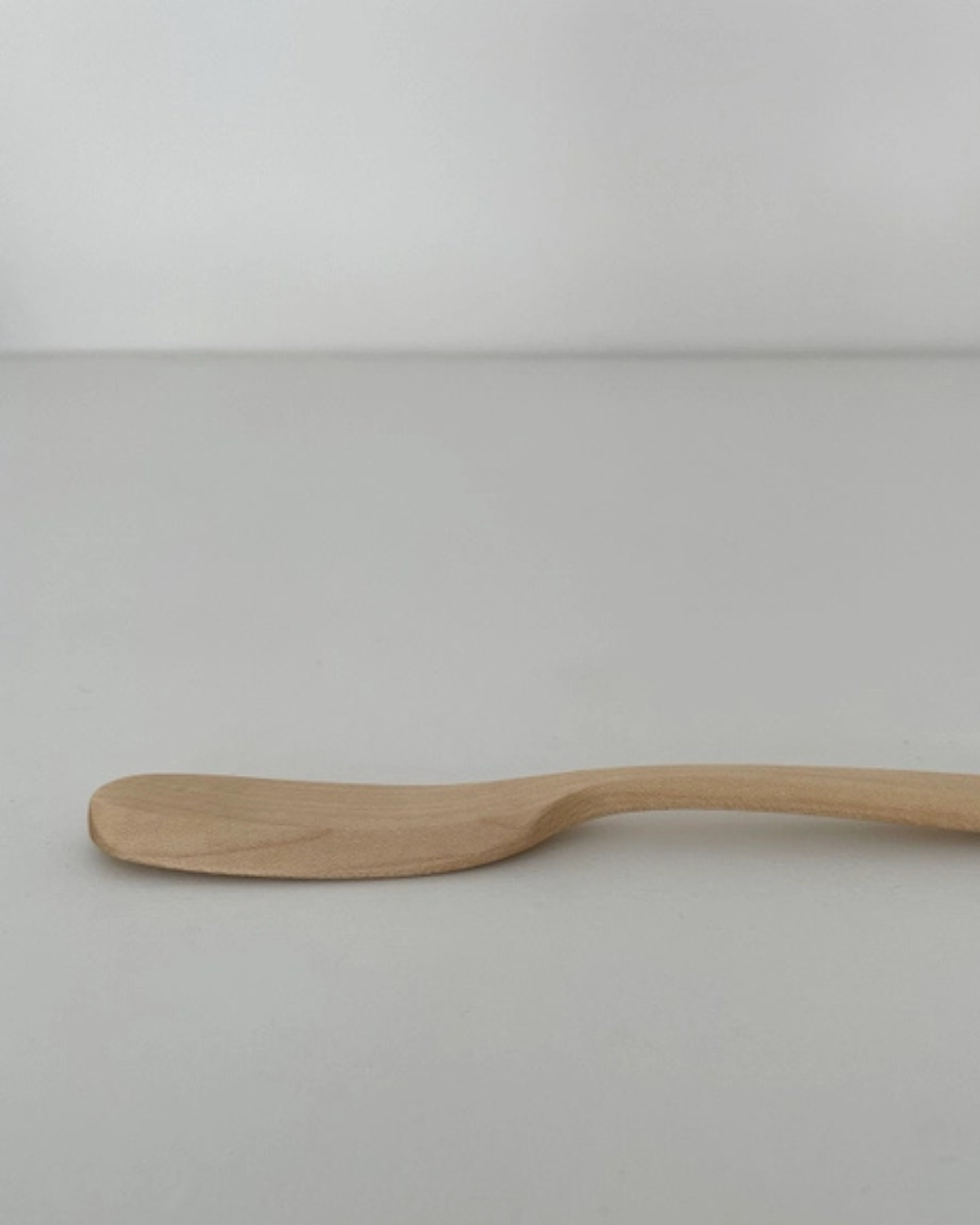 Handcrafted maple wood spreader